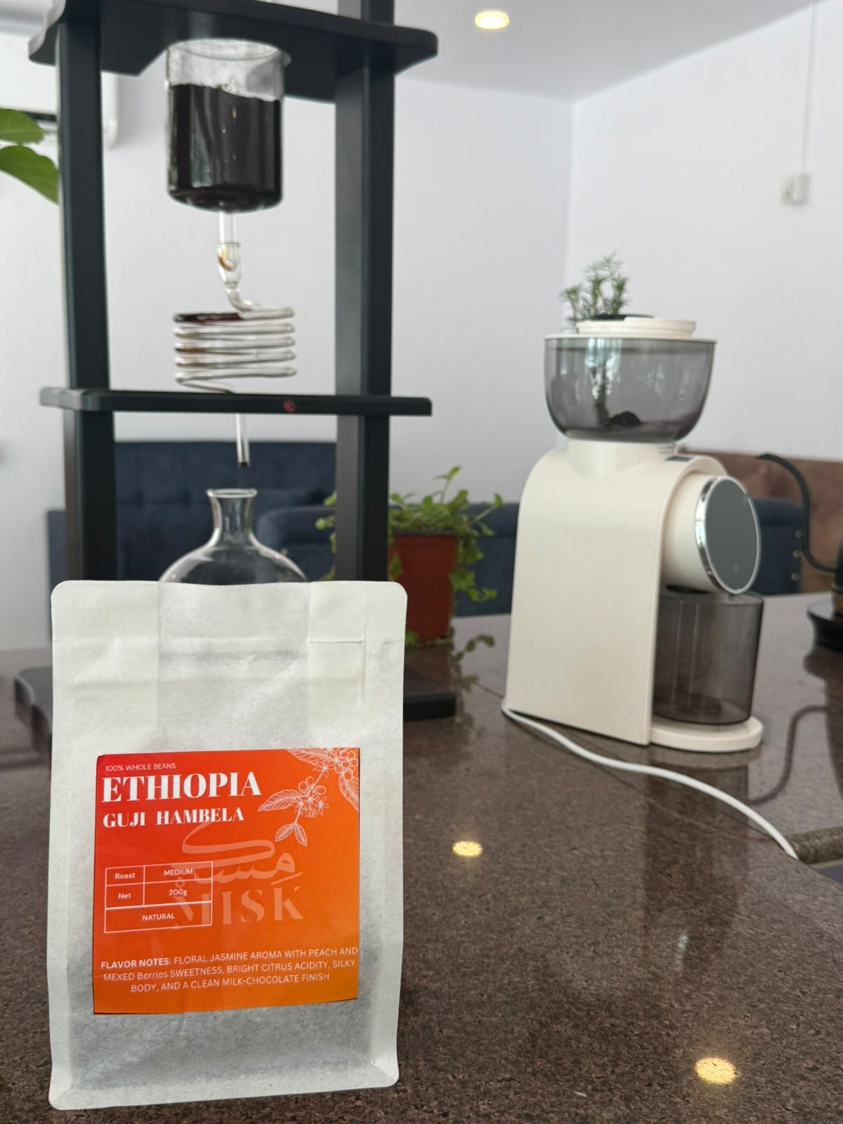 A bag of Ethiopia Guji Hambela beans next to the grinder